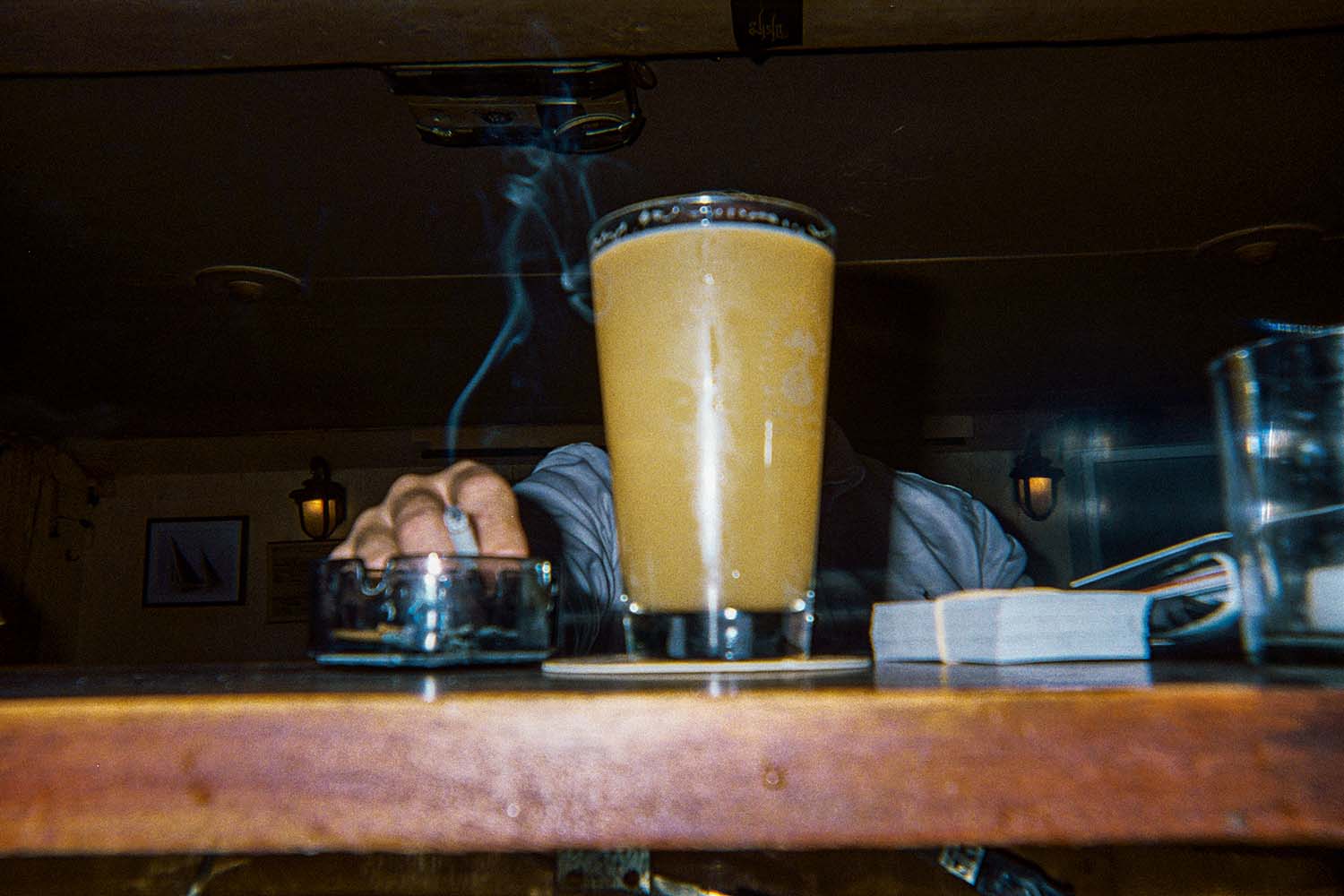 A quiet Monday night calls for beer and a smoke for one customer