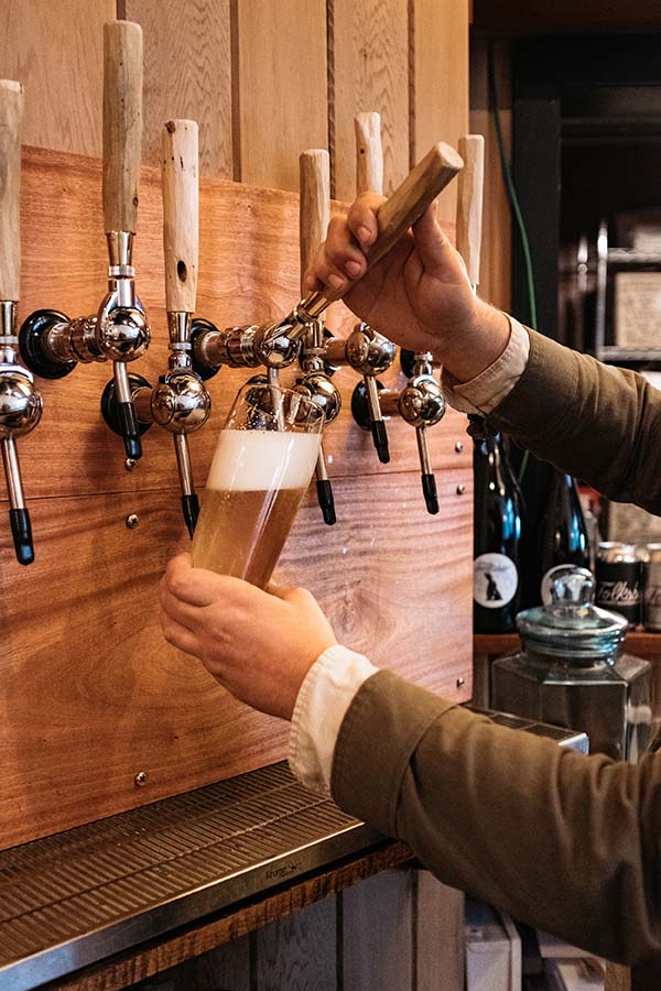 Founder Travis Kauffman pours me a pint of O.B.L. (Old Bavarian Lager), and all that is unassuming about Folksbier begins to make sense